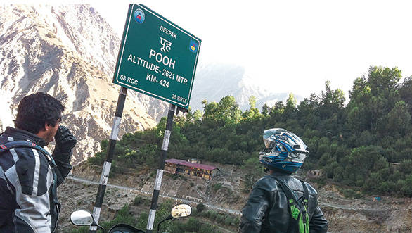 No, Alan is not reacting to the sign board, he's just popping his ears as we head up the mountains