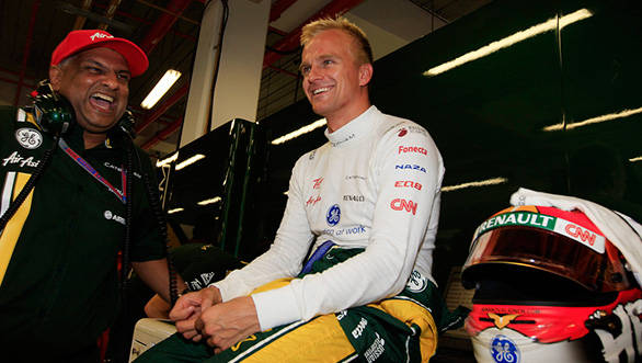 Tony shares a lighter moment with Heikki Kovalainen