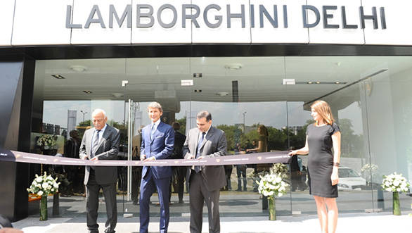 President and CEO of Automobili Lamborghini S.p.A. Stephan Winkelmann, along with the Lamborghini Delhi dealer principal Radhe Kapur and Yadur Kapur at the inauguration of Lamborghini's new dealership in New Delhi