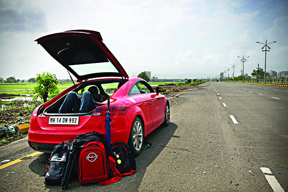 Lived with it, literally Who says sportscars can't be spacious? There was enough space for my backpack, travel bags, umbrella and me! Yes, with the rear seats folded, boot space transforms from 292 litres to 700 litres. This makes it as spacious as a lounge bed! After a week of driving through Mumbai's bumpy roads and potholes, the TT too felt rattled.