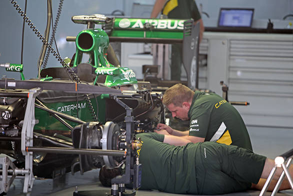 Caterham engineers working on their F1 car