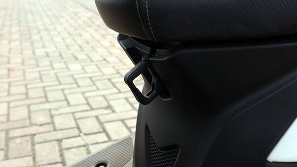The other bag hook is positioned under the pivot point of the seat ? that can be folded away when not in use
