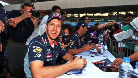 Sebastian Vettel (GER) Red Bull Racing at the autograph session. Formula One World Championship, Rd16, Indian Grand Prix, Buddh International Circuit, Greater Noida, New Delhi, India, Preparations, Thursday 24 October 2013.