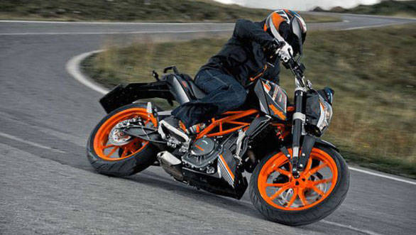 The black paint and orange wheels look a real tempting option than the white colour that the 390 is now available with