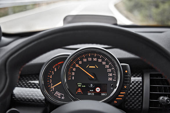 The central speedometer is adorned with LEDs that turn blue, orange or red depending on which mode the car is in, Mid, Sport or Green