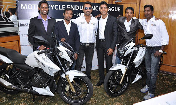 IML officials with the TVS Apache RTR180 motorcycles