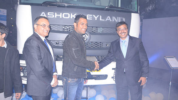 Ashok Leyland officials and Mahendra Singh Dhoni with the new Captain series trucks