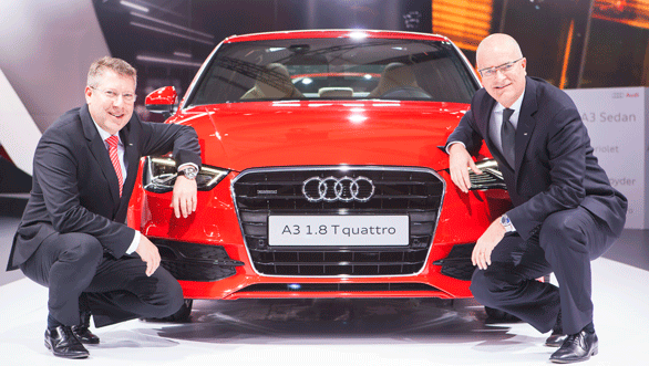 Mr.-Terence-Johnsson,-Vice-President,-Overseas-Sales-of-AUDI-AG-(Sitting-in-Right---Blue-Tie)-and-Mr.-Joe-King,-Head,-Audi-India-(Sitting-in-Left---Red-Tie)-with-the-Audi-A3-Sedan-at-Auto-Expo-2014