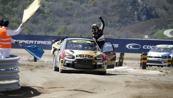 An ecstatic Petter Solberg took the winners trophy at Portugal
