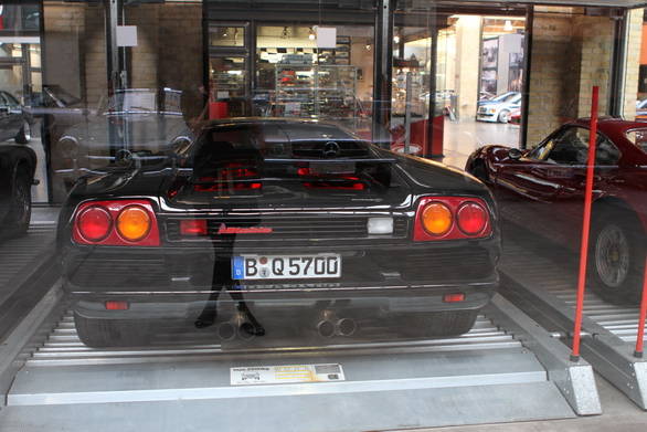 Owners can store their cars in glass cases to protect them from the elements - like this Lamborghini Diablo and that Ferrari Dino you see peeking out the corner