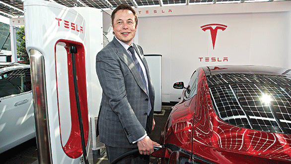 Tesla CEO Elon Musk at the opening of the company's first Supercharger fast charge station in the UK. Musk hopes the more freely available patents will speed up EV development