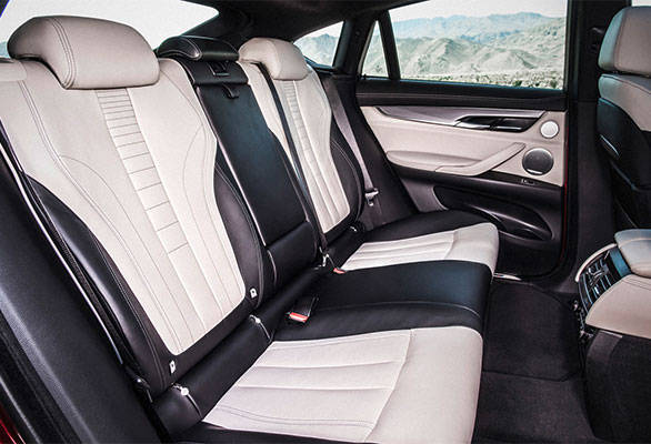 Generous legroom at the rear, however, the coupe style sloping roofline will eat into head room