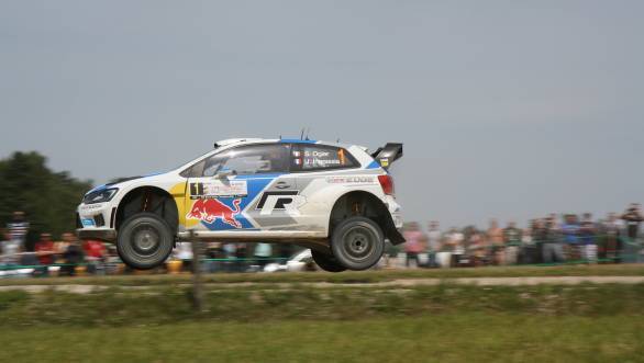 The Volkswagen Polo R WRC of Sebastien Ogier and Julien Ingrassia airborne at the Goldap stage