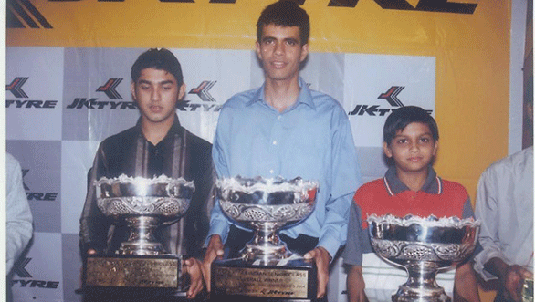 Armaan Ebrahim, Rayomand Banajee and Vishnu carrying a trophy that's bigger than he is!