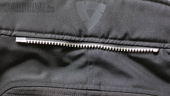 This is the connection zipper which usually comes in 8- or 10-inch versions at the back of the pants. The other half is included so you can sew it on to your favorite jacket. Better pants will have two zippers, this one and another one that goes all the way around for a 360 degree connection