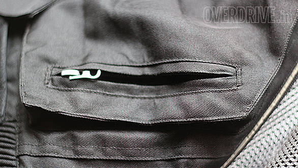 Rule one of pants on motorcycle pants is they should have a positive closure mechanism - ideally a waterproof zipper. Take the time to note how easy it is to get stuff into and out of the pocket, especially with gloves on - not all pockets are born equal