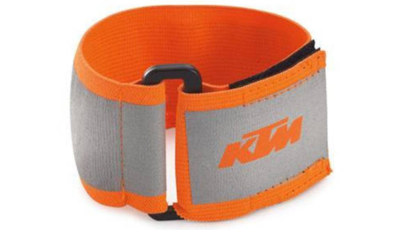 This is a KTM-branded arm band where all the silver-grey areas light up a bright white under headlights. I use these to secure my knee armour as well as increase my visibility