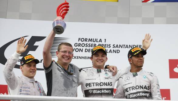 Nico Rosberg, flanked by Valtteri Bottas and Lewis Hamilton on the podium at Hockenheim