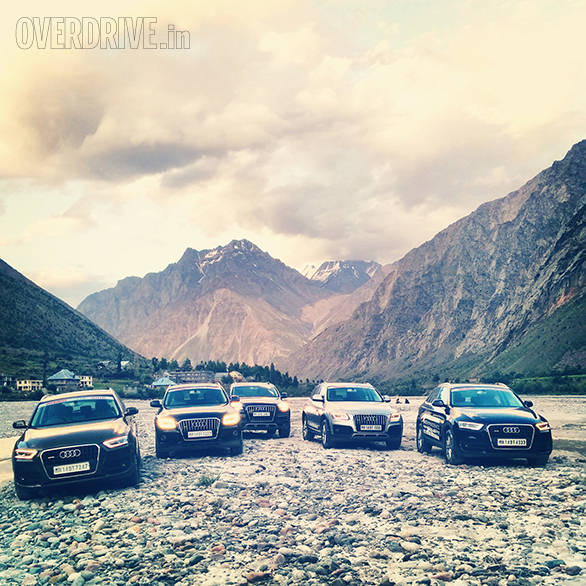 The Audis take a breather at Jispa. In the back are the couple of hotels and in the foreground is the wide swathe of river bed which is the central feature of the beautiful valley Jispa is located in.