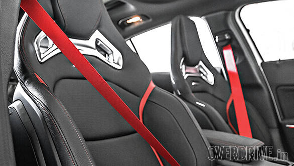 Lovely sports seats are firm but supportive and comfortable and come with contrasting red seatbelts