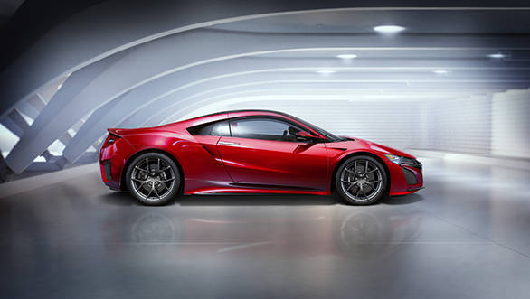 The body features classic low and wide proportions, sharply contoured surfaces, an aggressive front design, and tail lights that pay homage to the original NSX.