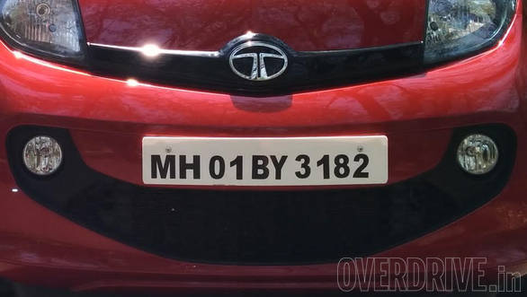 Tata loves smiley grilles and the face gets one too. It also integrates round fog lights. Also notice the gloss-black applique on the nose, bearing the Tata logo