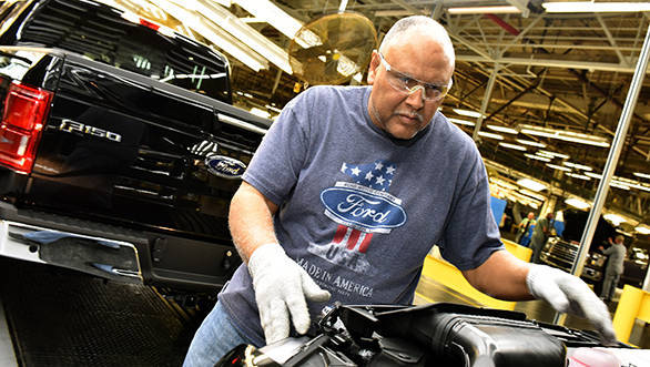 CLAYCOMO, MO. March 13, 2015--Ford Motor Company team member, Ronald Wolfskill inspects the all-new Ford F-150 at Ford'??s Kansas City Assembly Plant.  Ford celebrated Job One, the official start of production of the toughest, smartest, most capable, F-150 ever.  Photo by: Sam VarnHagen