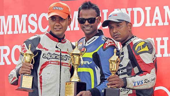 Rajini Krishnan (centre) of Moto-Rev Yamaha Racing team, who won the Group B (165cc) Open race on Sunday in the MMSC FMSCI Indian National Racing Championship, flanked by second-placed Harry Sylvester of TVS Racing (right) and third placed Sarath Kumar of Ten10 Racing (left).