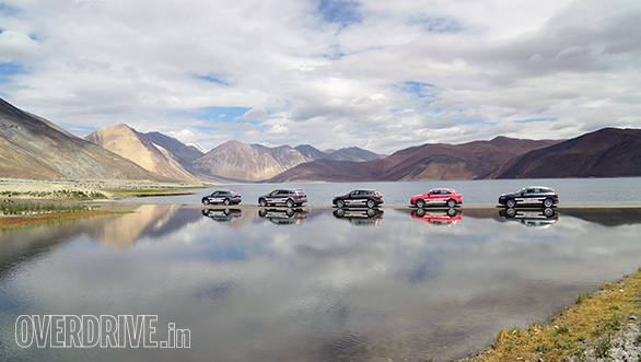 The Audi SUVs pose against the backdrop of the Pangong Lake