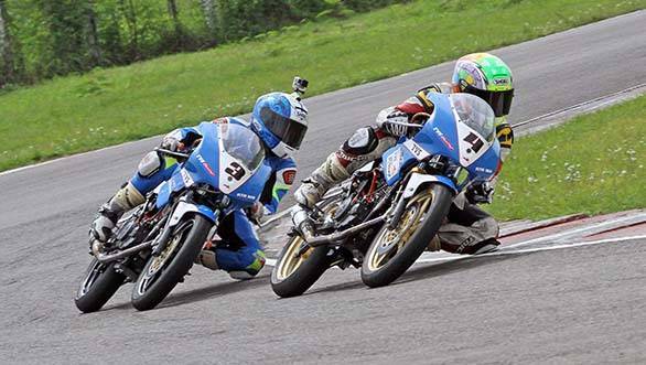 Jagan Kumar (No.3) slips past his TVS Racing team-mate Harry Sylvester on way to winning the Group B (165cc) Open race in the third round of the MMSC FMSCI Indian National Racing Championship in Chennai on Saturday