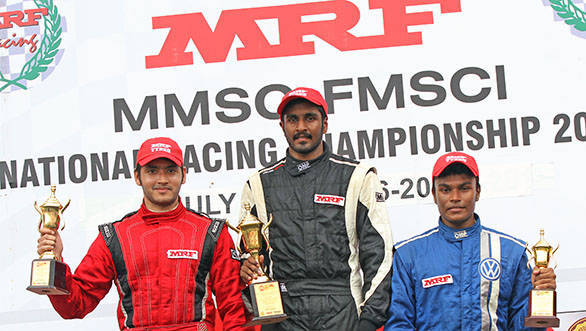  Arjun Narendran (centre), winner of the second race in the MRF F1600 class flanked by second-placed Goutham Parekh (left) and Karthik Tharanisingh who came in third
