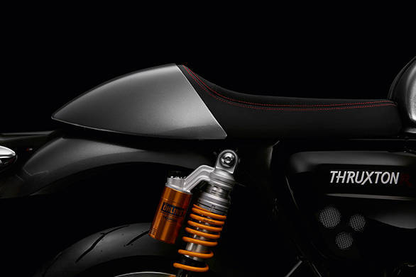 Like the current Thruxton, the 2016 Triumph motorcycle will also get a seat cowl covering the pillion seat. Note Ohlins all-adjustable shocks on the R model with their remote reservoirs