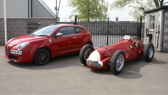 The Alfa Romeo 158 in which Giuseppe Farina won the first ever F1 championship in 1950 stands next to an Alfa Romeo Mito