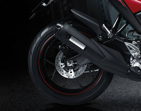 The rear features an upswept exhaust, single disc brake and a monoshock. The wheels look similar to the YZF-R3 