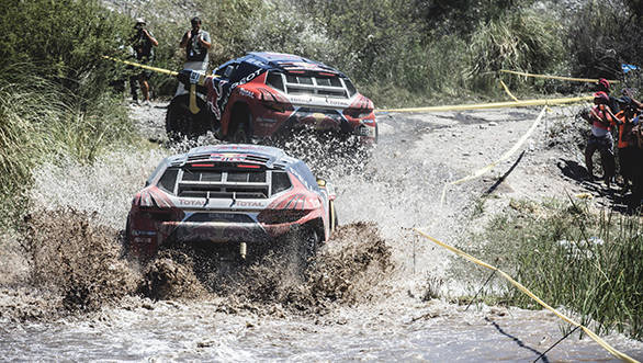 Sebastien Loeb (FRA) from Team Peugeot Total  is towed by Cyril Despres (FRA) during stage 11 of Rally Dakar 2016 from La Rioja to San Juan, Argentina on January 14, 2016. // Flavien Duhamel/Red Bull Content Pool // P-20160115-00007 // Usage for editorial use only // Please go to www.redbullcontentpool.com for further information. //