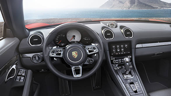 A new 918 Spyder style steering wheel in the otherwise familiar cabin