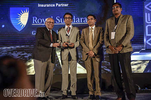 Ralas Motors getting the runner up award from Vinay Nevatia, past president FADA and Anup Kumar Saha, general manager, ICICI Bank