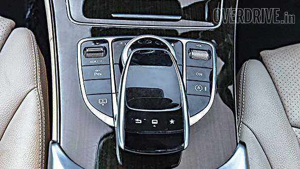 A touchpad and scroll wheel control the Comand infotainment system
