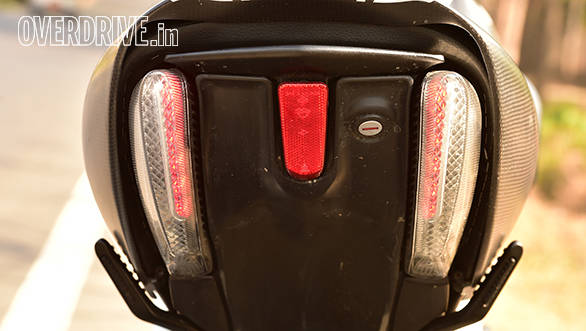 Dual LED strips double up as brake lamps and turn signals. Single grab rail can be extended by using a release mechanism under the seat. Check out how neatly the pillion foot rests fold into the body work