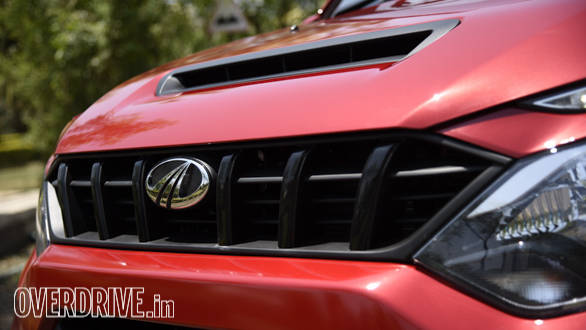 Slim grille looks good and the hood scoop is functional, feeding cool air to the top mounted radiator