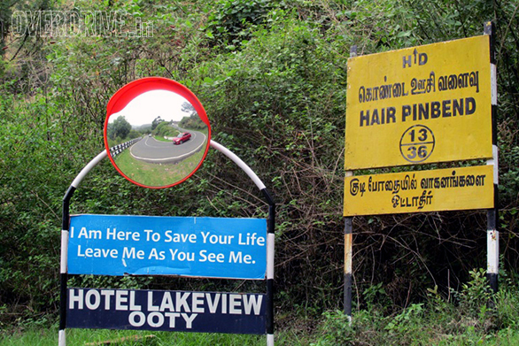 Curved mirrors on the Sigur Ghat show oncoming traffic. It has 36 hairpin bends