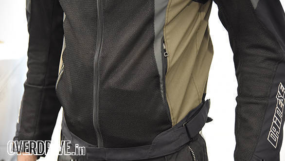 Waist adjusters fine-tune fit. The jacket sits so snug that putting anything in the pockets creates an unsightly bulge