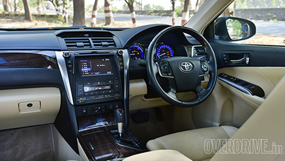 The Camry's interior feels a little plasticky, but the rear seat is more comfortable
