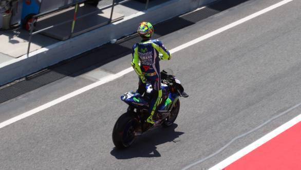 Those signature Rossi moves that are impossible to miss. Here caught in the tricky act of, er... adjusting his riding leathers