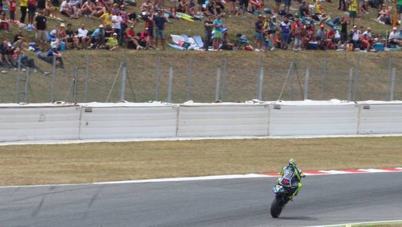 Valentino Rossi pulls a wheelie for the cheering crowds at the Catalan GP