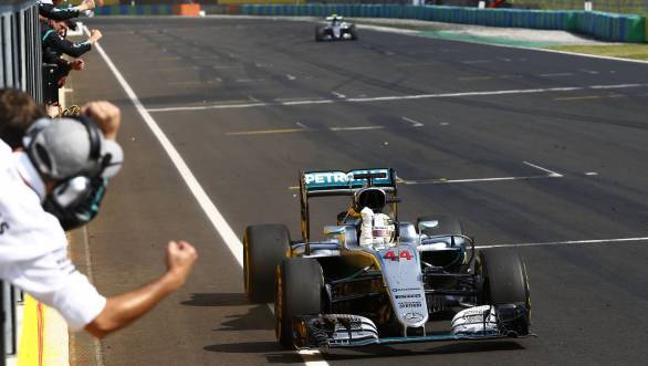 Lewis Hamilton celebrates as he crosses the line first at the 2016 Hungarian GP and moves into the lead of the driver's championship