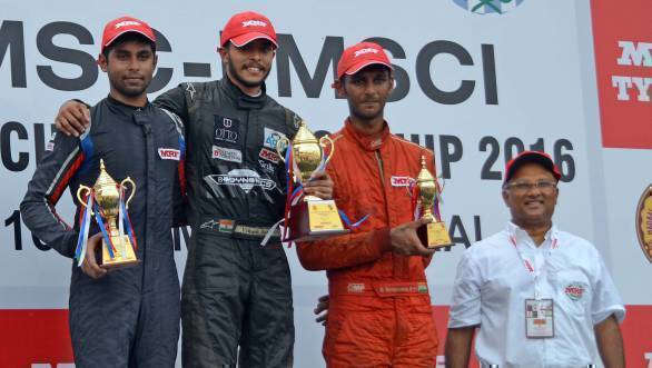 Vikash Anand, flanked by Anindith Reddy and Raghul Rangaswamy on the podium for Race 3 in the MRF 1600 class