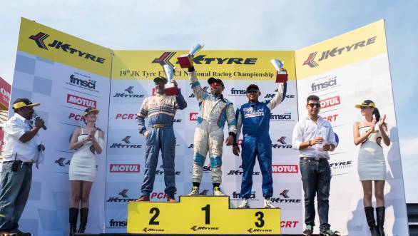 Ashish Ramaswamy flanked by Radha Selvarajan (left) and Deepak Chinnappa (right) celebrate their podium positions in the second JK Touring Car race of Round 3 at the Kari Motor Speedway