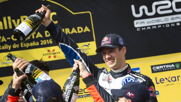 Sebastien Ogier celebrates his victory at Rally Catalunya, which helped him seal his fourth consecutive World Rally Championship title