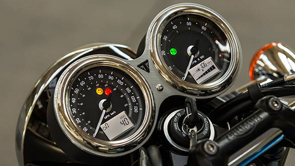 The T100 gets classic twin-pod clocks with analog readouts for road and engine speed